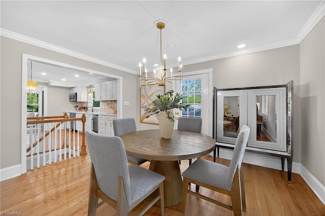 506 Audubon Dr, Greensboro, NC 27410 - dining room featuring a chandelier, ornamental molding, light wood-style flooring, and recessed lighting