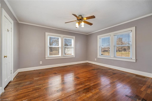 spare room featuring ceiling fan, ornamental molding, and dark hardwood / wood-style floors