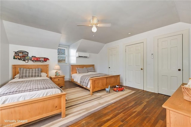 bedroom featuring dark wood-type flooring, ceiling fan, a wall mounted AC, and vaulted ceiling