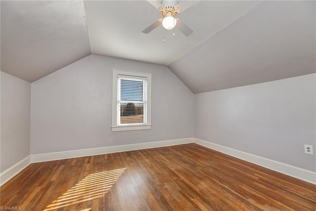 additional living space featuring lofted ceiling, hardwood / wood-style floors, and ceiling fan