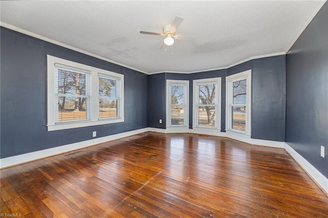 unfurnished room featuring ceiling fan, ornamental molding, and wood-type flooring