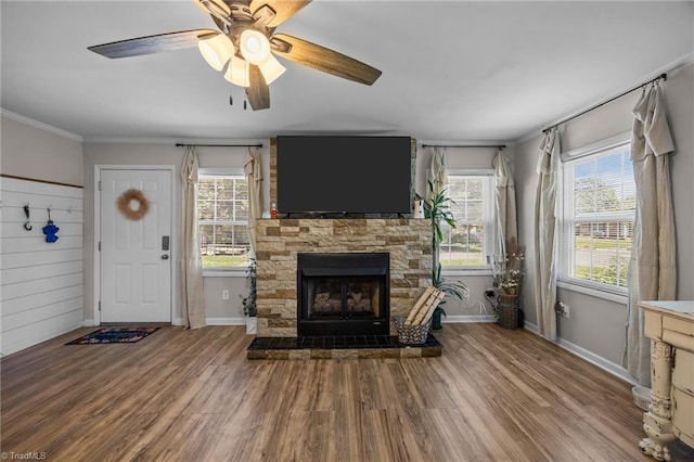 202 Stokes Forest Dr, King, NC 27021 - unfurnished living room featuring wood finished floors, crown molding, a fireplace, ceiling fan, and baseboards