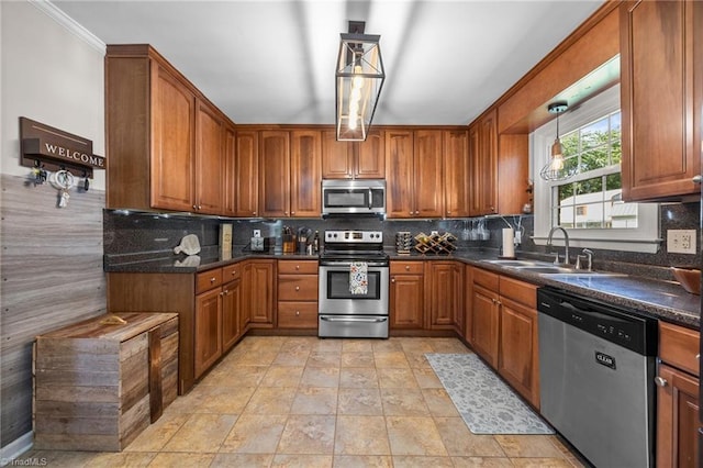 202 Stokes Forest Dr, King, NC 27021 - kitchen featuring stainless steel appliances, a sink, brown cabinets, and dark countertops