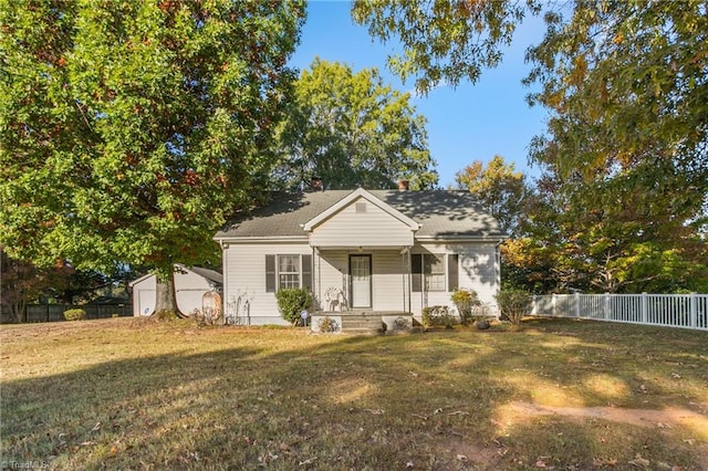 bungalow-style home featuring a front yard