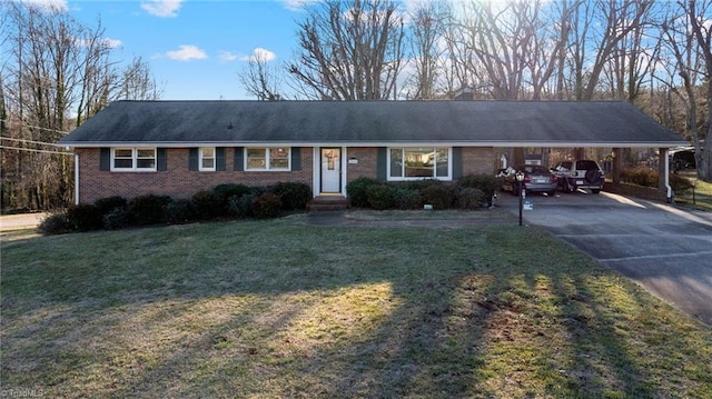 single story home featuring a carport and a front yard