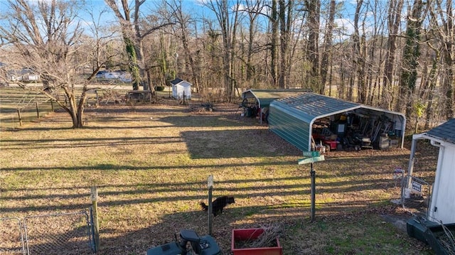 view of yard featuring an outbuilding and a carport