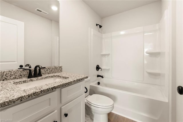 full bathroom featuring vanity, toilet, shower / bathing tub combination, and hardwood / wood-style flooring