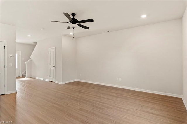 empty room featuring ceiling fan and light wood-type flooring