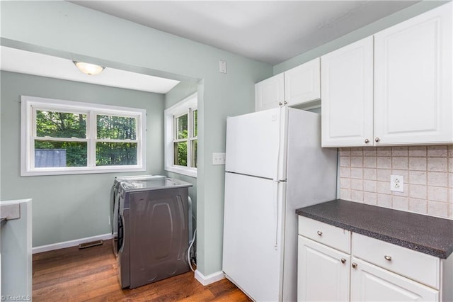 1093 Gordon Rd, Pinnacle, NC 27043 - kitchen featuring freestanding refrigerator, washer / dryer, plenty of natural light, and dark countertops