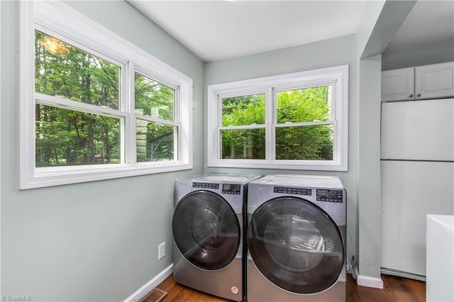 1093 Gordon Rd, Pinnacle, NC 27043 - laundry room with washer and dryer and dark wood-style flooring