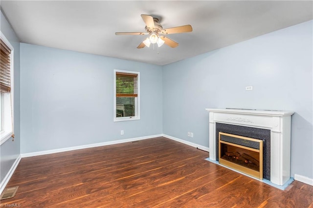 1093 Gordon Rd, Pinnacle, NC 27043 - unfurnished living room featuring a ceiling fan, a fireplace with flush hearth, and wood finished floors