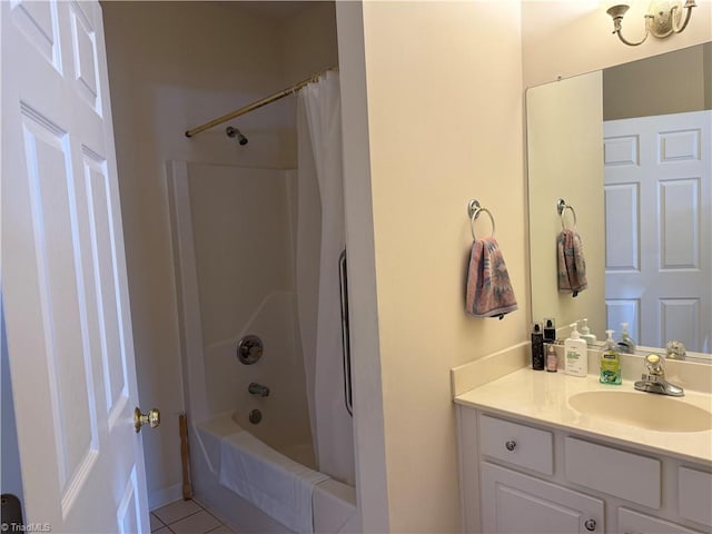 bathroom with tile patterned flooring, shower / bath combination with curtain, and vanity