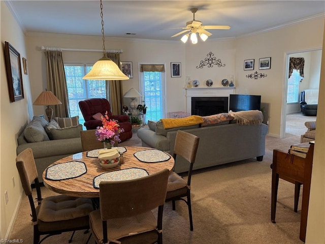 dining space featuring light colored carpet, visible vents, and ornamental molding