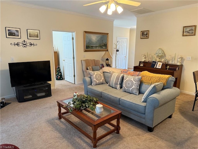 carpeted living area with visible vents, baseboards, a ceiling fan, and ornamental molding