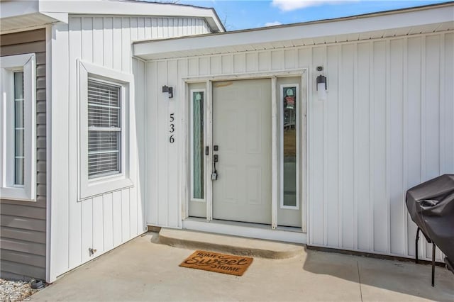 entrance to property with a patio area