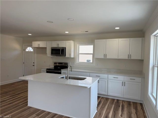 503 W End Blvd, Madison, NC 27025 - kitchen with appliances with stainless steel finishes, a sink, white cabinetry, wood finished floors, and ornamental molding
