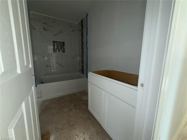 bathroom featuring concrete flooring and shower / washtub combination