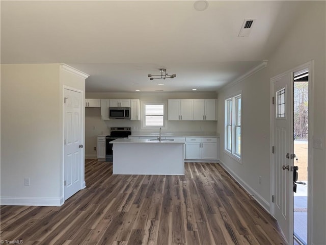503 W End Blvd, Madison, NC 27025 - kitchen featuring appliances with stainless steel finishes, a sink, white cabinets, baseboards, and plenty of natural light