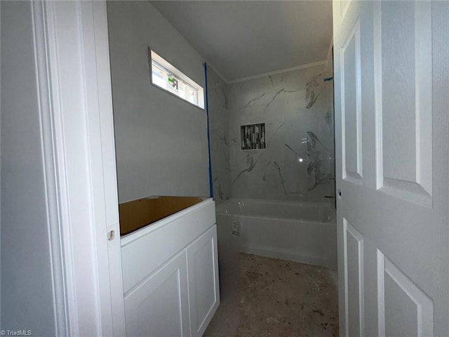 bathroom featuring washtub / shower combination and crown molding