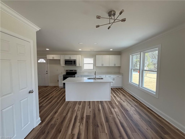 503 W End Blvd, Madison, NC 27025 - kitchen with a sink, stainless steel appliances, crown molding, a chandelier, and white cabinets