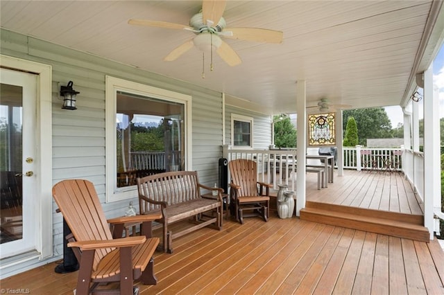 deck featuring covered porch and ceiling fan