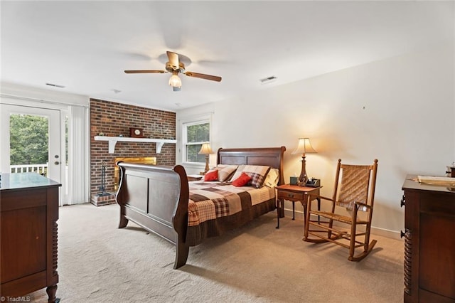 bedroom featuring visible vents, light carpet, baseboards, and access to outside