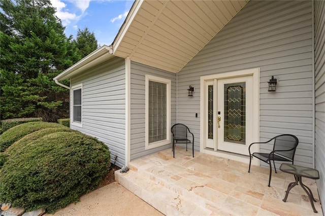 entrance to property with a patio