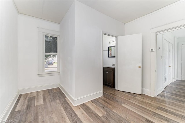 unfurnished room with hardwood / wood-style flooring