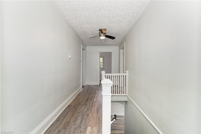 hall with wood-type flooring