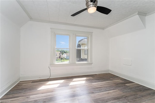 spare room with ceiling fan, crown molding, and wood-type flooring