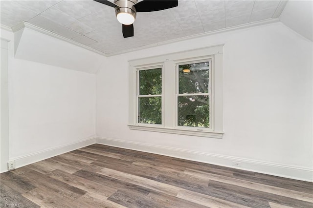 spare room featuring hardwood / wood-style flooring, ceiling fan, and ornamental molding