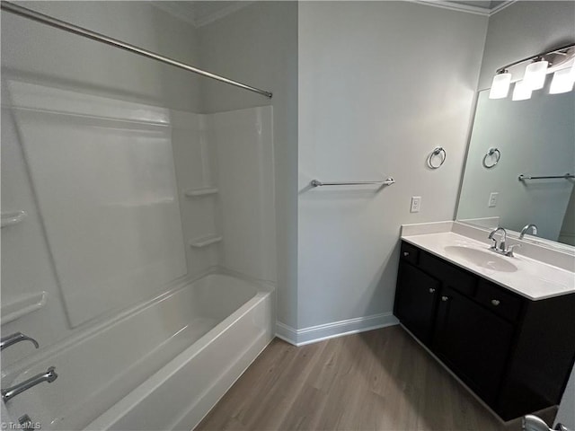 bathroom featuring vanity, hardwood / wood-style floors, and tub / shower combination