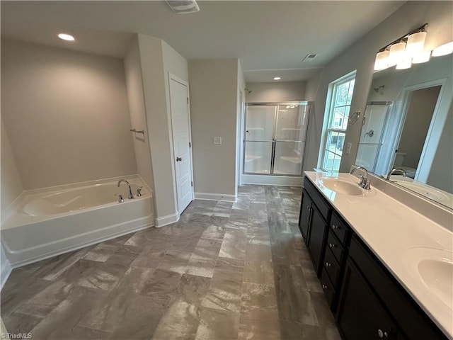 bathroom with vanity and separate shower and tub