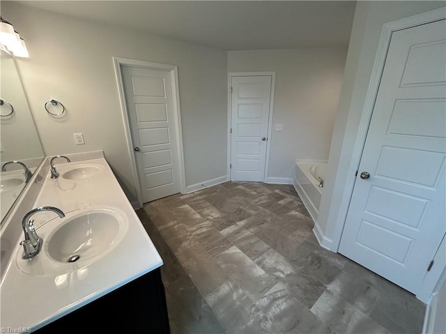 bathroom featuring vanity and a tub