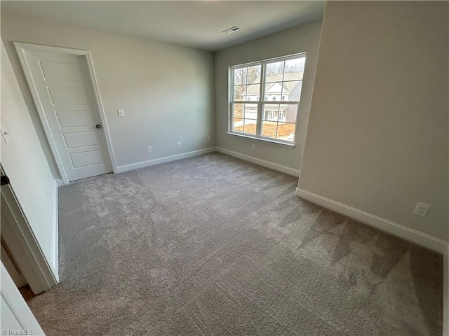 spare room featuring carpet flooring