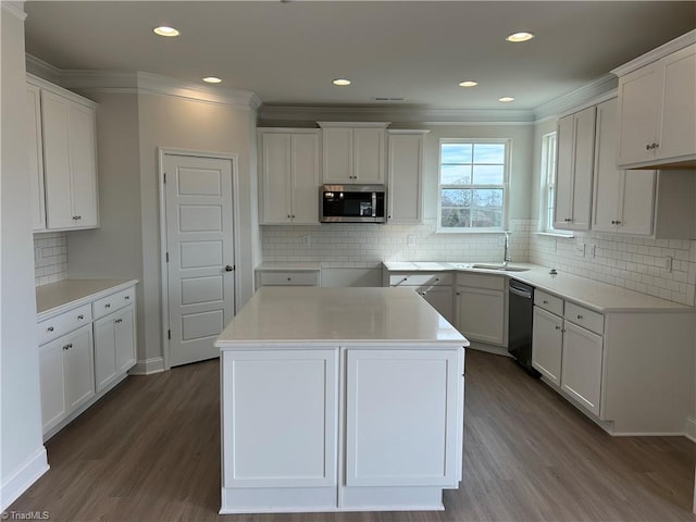 kitchen featuring white cabinetry, black dishwasher, sink, a center island, and dark wood-type flooring