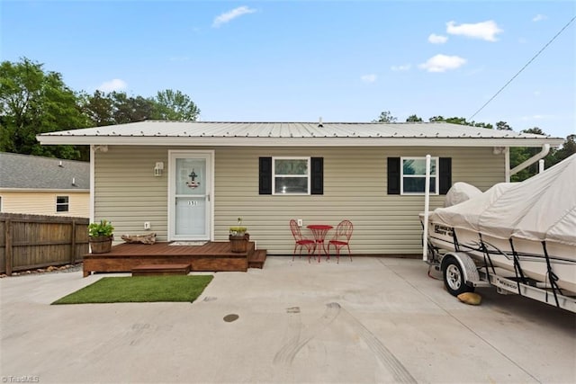 151 N Shore Dr, Lexington, NC 27292 - view of front facade with a patio, fence, and metal roof