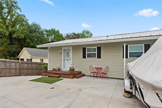 151 N Shore Dr, Lexington, NC 27292 - rear view of house with fence, a patio, and metal roof