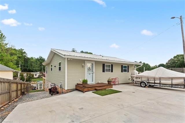 151 N Shore Dr, Lexington, NC 27292 - view of front of property featuring fence, a patio, and metal roof