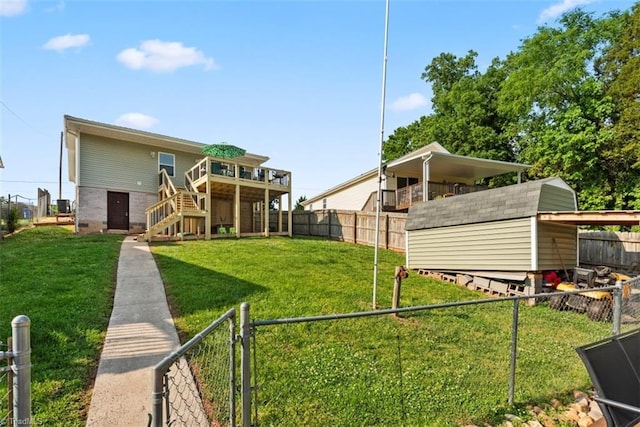 151 N Shore Dr, Lexington, NC 27292 - view of yard featuring an outbuilding, a wooden deck, a storage shed, and a fenced backyard