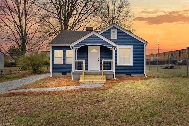 bungalow with crawl space, a chimney, a front lawn, and fence