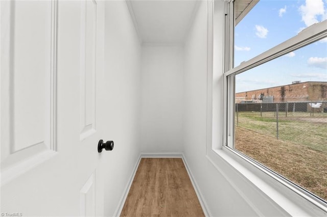 spacious closet with wood finished floors