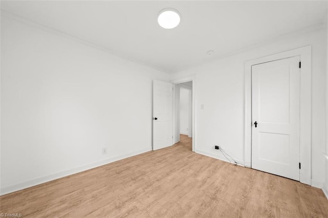 unfurnished bedroom featuring baseboards and light wood finished floors