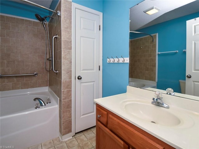 bathroom featuring shower / bathing tub combination, vanity, tile patterned flooring, and toilet