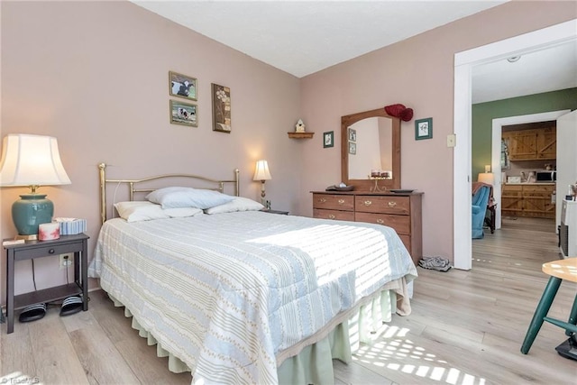 bedroom with light hardwood / wood-style flooring