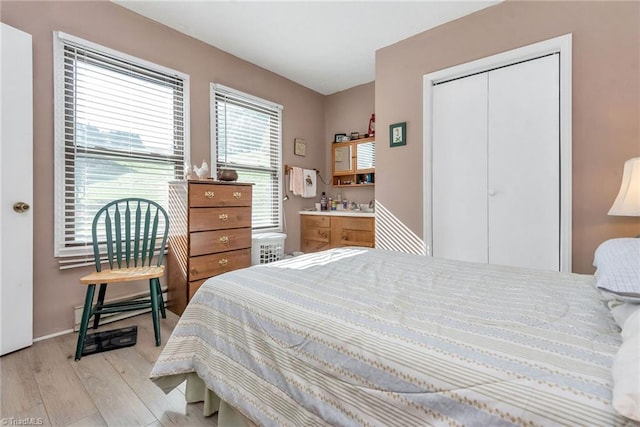 bedroom featuring a closet and light hardwood / wood-style floors