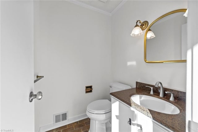 half bathroom featuring visible vents, baseboards, toilet, ornamental molding, and vanity