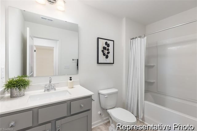 bathroom featuring shower / bath combo, baseboards, visible vents, toilet, and vanity