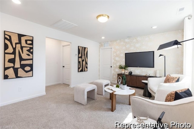 living area featuring baseboards, recessed lighting, visible vents, and light colored carpet