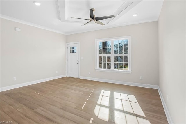 unfurnished room featuring ceiling fan, light hardwood / wood-style flooring, and ornamental molding